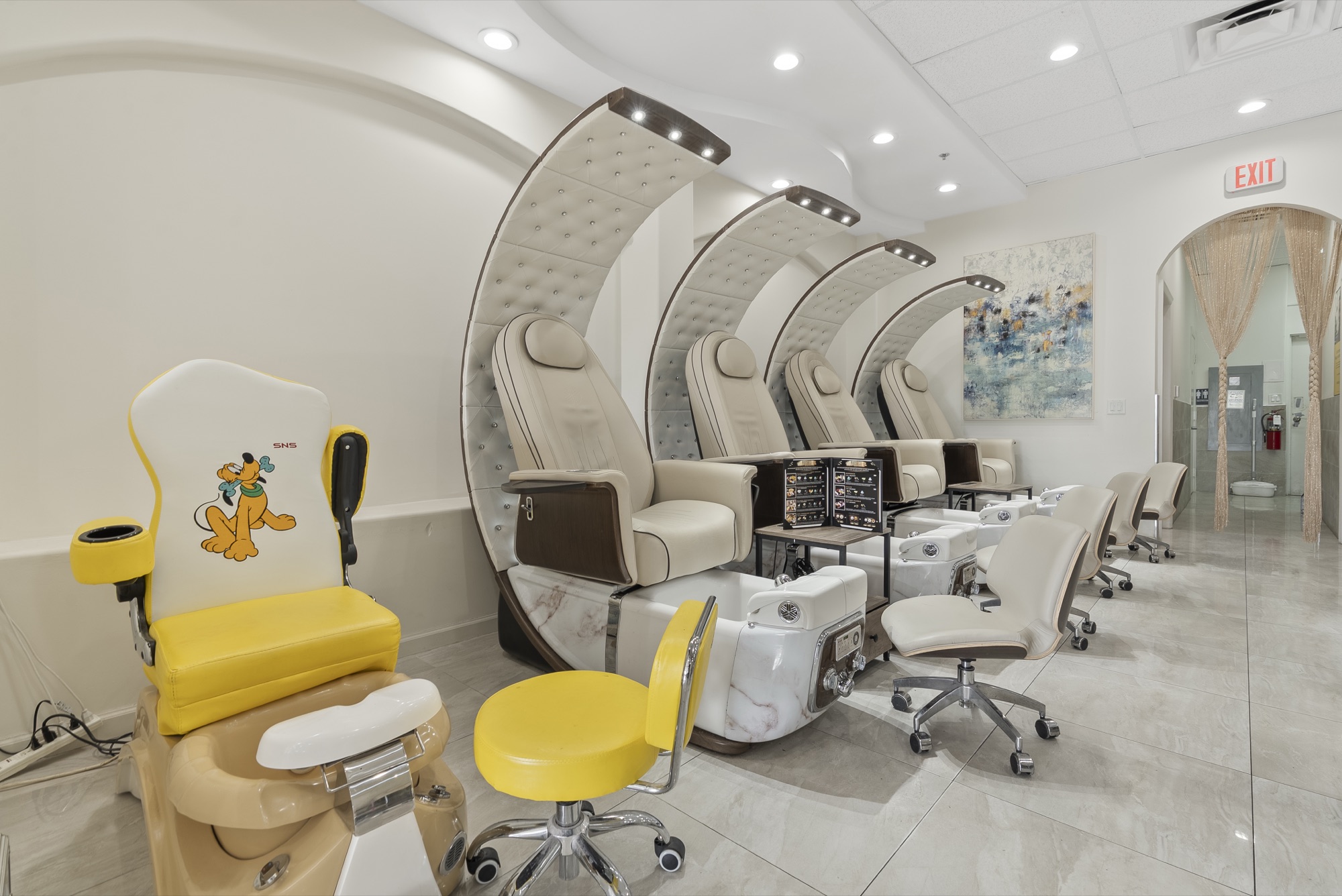 Pedicure lounge with cream dome chairs