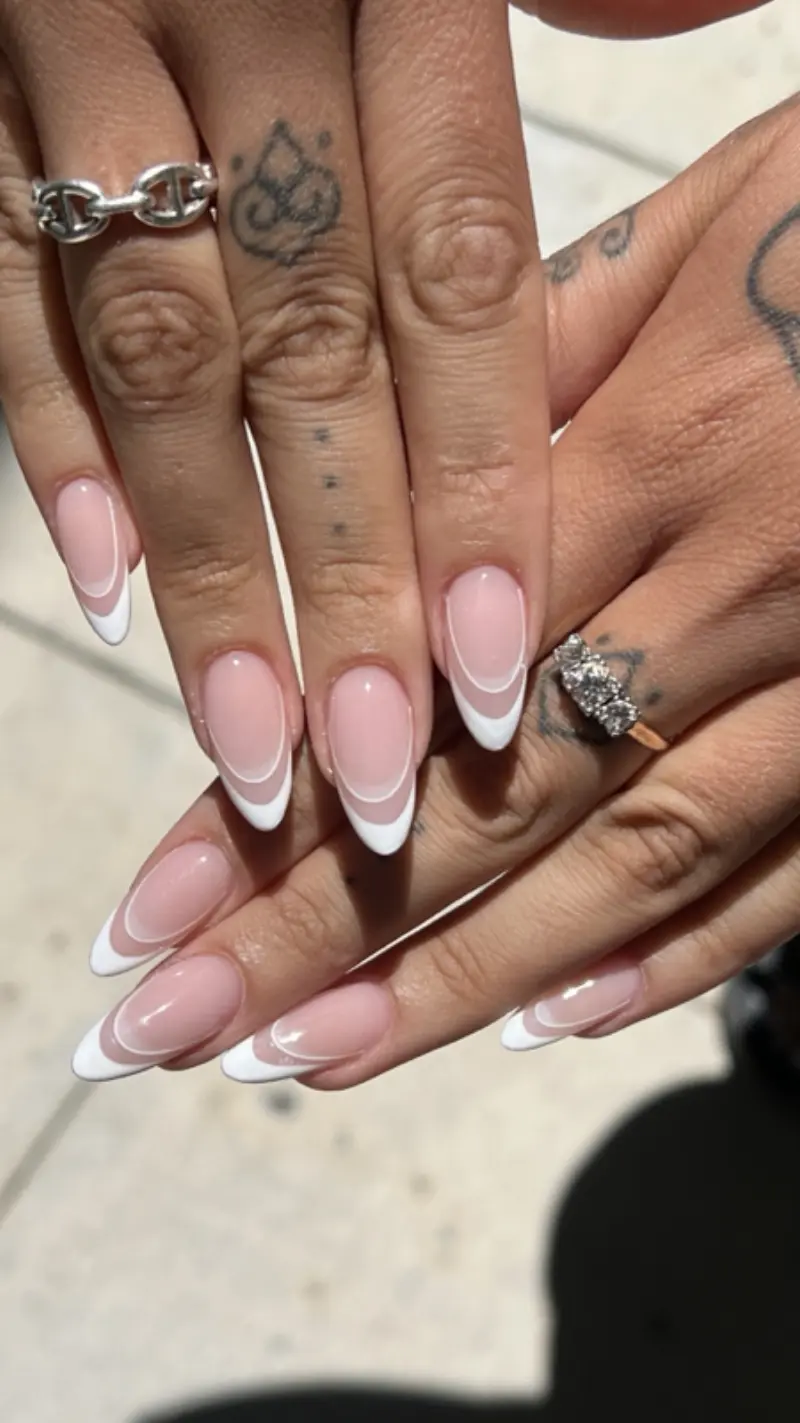 Almond long nails with classic white French tips