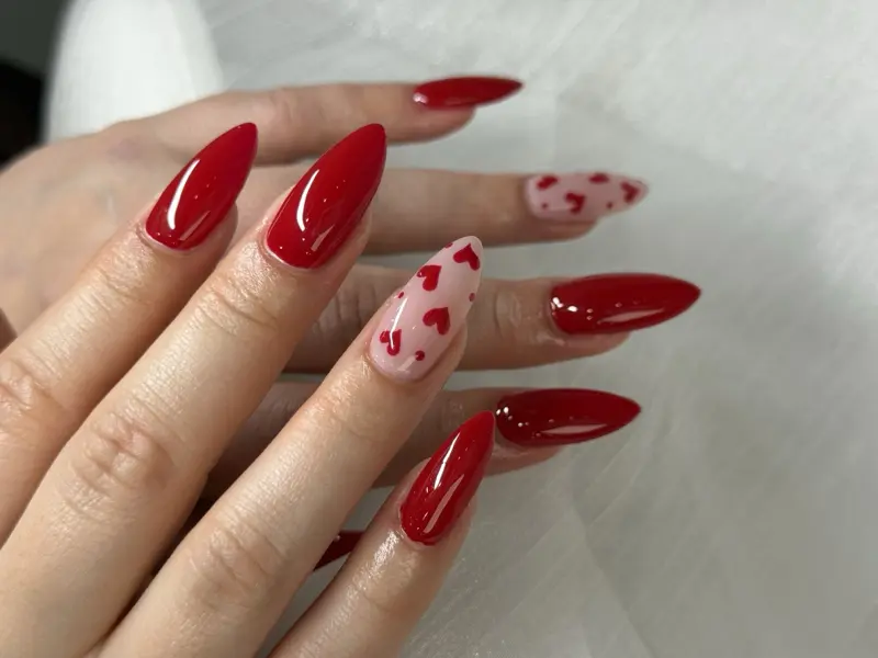 Almond long nails with hand painted red hearts