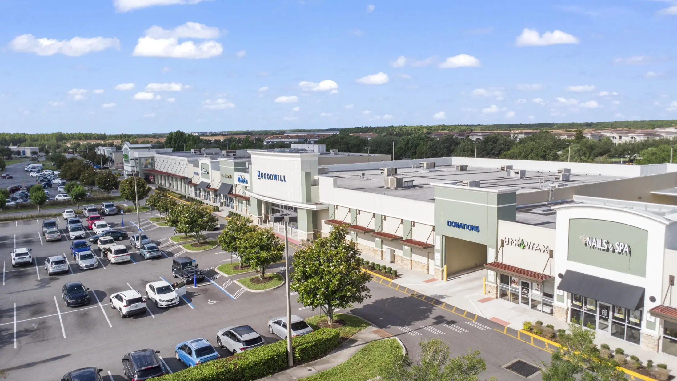 Aerial view of Trust Nails plaza storefront